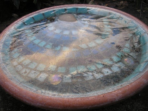 My mosaic bird bath that I made at a Women's Institute meeting. I must boil a kettle and thaw it out.